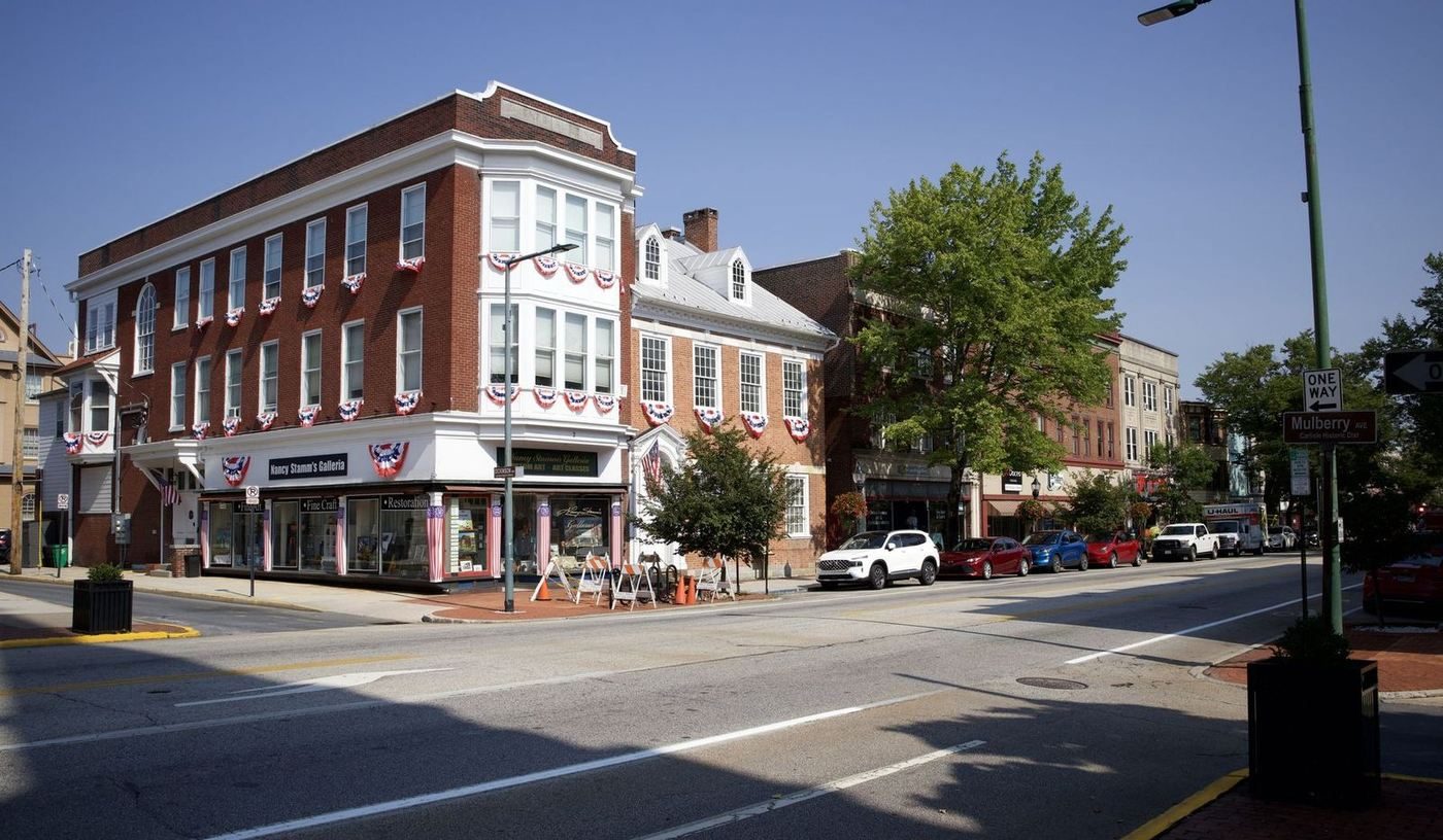 A brick corner storefront on Hanover Street in downtown Carlisle, Pennsylvania